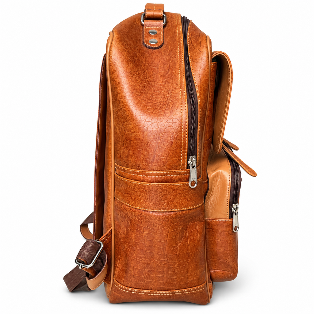 Side profile of tan brown ZARVÉN croc-embossed leather backpack