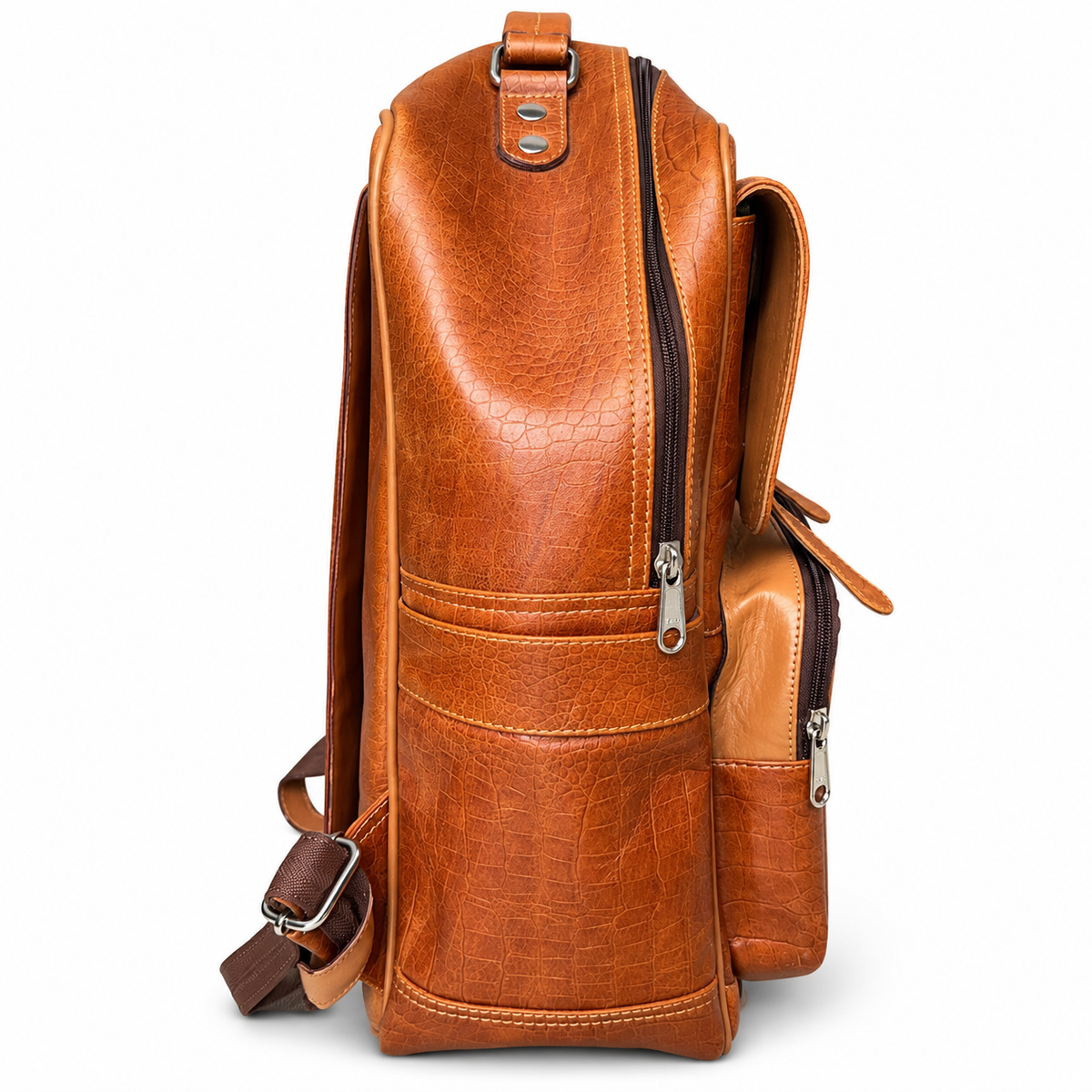 Side profile of tan brown ZARVÉN croc-embossed leather backpack