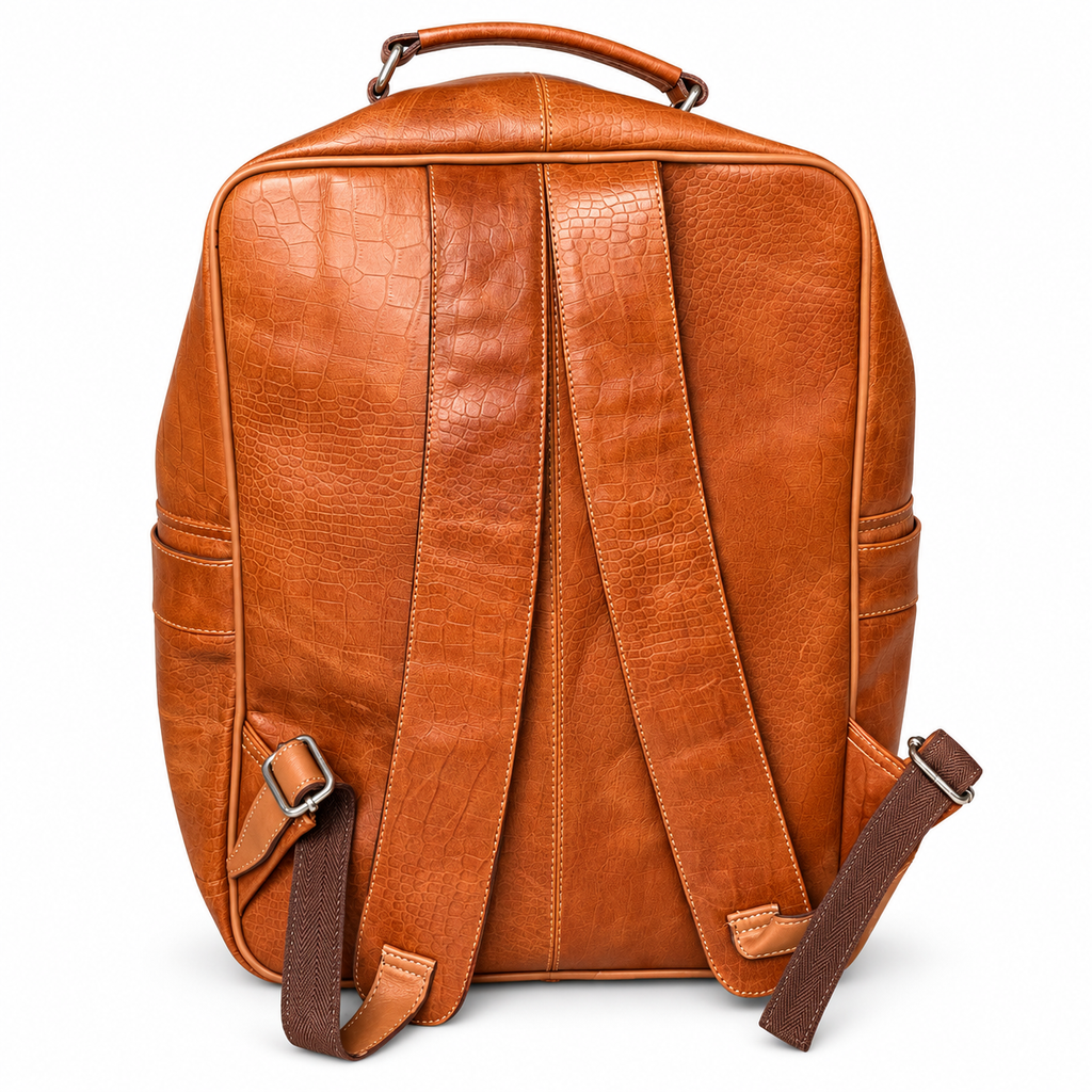 Rear view of tan brown croc-embossed leather backpack and shoulder straps