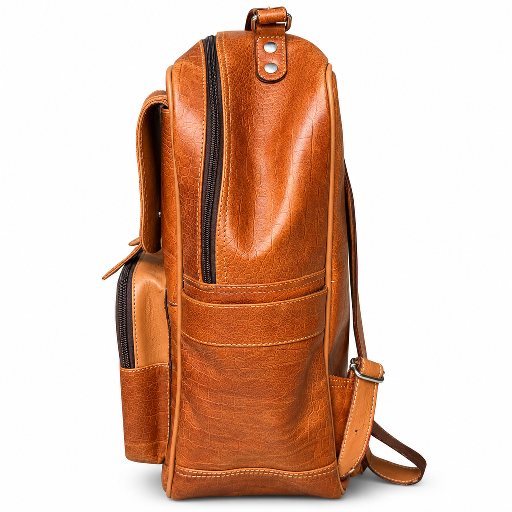Alternate side view of tan brown croc-textured leather backpack