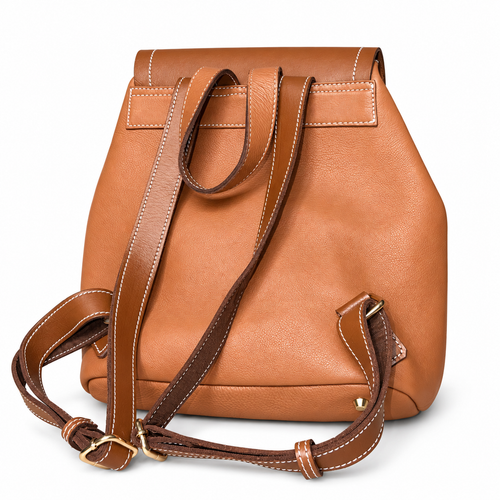Close view of tan brown Heritage leather backpack with gold-tone hardware